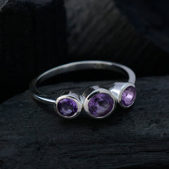 Lily silver ring featuring a purple gemstone trilogy ring design with three round purple stones