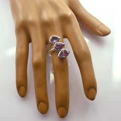 Saanvi purple gemstone trilogy ring with three pear shaped stones set in silver open band on hand model