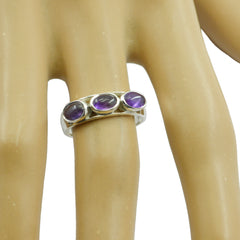 Ayaka sterling silver purple gemstone trilogy ring with three round amethyst cabochons on finger