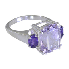 Carolina purple gemstone trilogy ring with cushion cut center amethyst and two round purple side stones