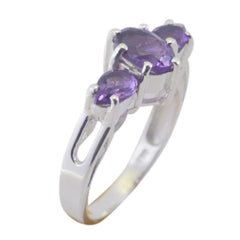 Kristine purple gemstone trilogy ring with three oval purple stones set in polished silver band
