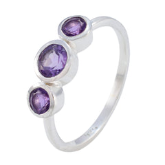 Lily purple gemstone trilogy ring with three oval purple stones set in silver band