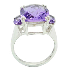 Layla purple gemstone trilogy ring with a large central purple stone and two smaller side stones in silver setting
