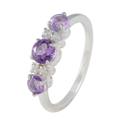 Emi purple gemstone trilogy ring with three amethyst stones and clear accent gems in silver band