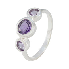 Ying purple gemstone trilogy ring with three round purple stones set in silver band