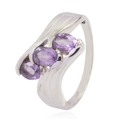 Bruna purple gemstone trilogy ring with three oval purple gemstones set in polished silver band