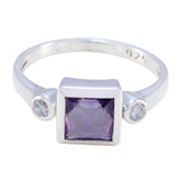 Scarlett purple gemstone trilogy ring with square purple center stone and two small clear side stones