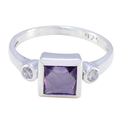 Scarlett purple gemstone trilogy ring with square purple center stone and two small clear side stones