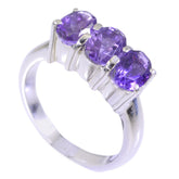 Anna purple gemstone trilogy ring with three purple gemstones set in silver band