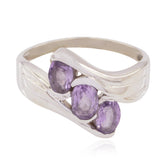 Bruna elegant purple gemstone trilogy ring with three oval purple stones set in a silver band