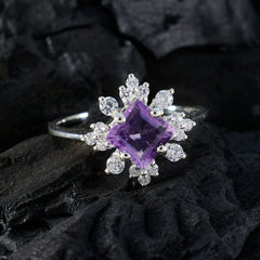 Hua purple halo ring featuring a square purple gemstone surrounded by sparkling clear stones on silver band