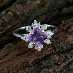 Hua purple halo ring featuring a square purple gemstone surrounded by clear accent stones on silver band