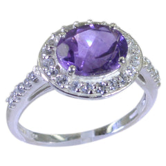 Yasmin purple halo ring with oval purple gemstone center surrounded by sparkling halo and pave diamond band