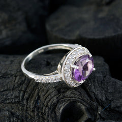 Yasmin purple halo ring with round purple gemstone center and diamond halo on sterling silver band