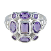 Emily purple navratna gemstone ring with multiple oval and rectangular purple gemstones set in silver