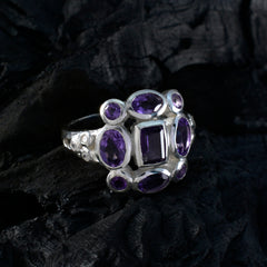 Emily silver purple navratna gemstone ring with multiple oval and square purple stones on dark background