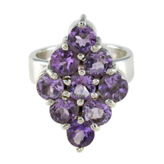Penelope purple navratna ring with clustered round purple gemstones set on a polished silver band