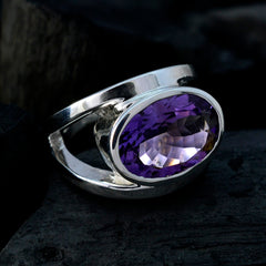 Priya purple solitaire ring with large faceted oval gemstone set in polished silver band