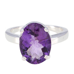 Andrea purple solitaire ring featuring an oval faceted gemstone set in a silver band