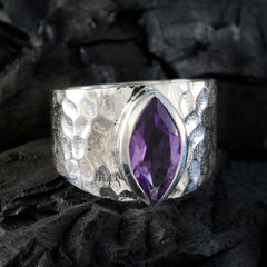Siti purple solitaire ring with marquise cut gemstone set in textured silver band