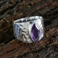 Siti purple solitaire ring with marquise cut gemstone set on hammered silver band