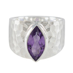 Siti silver ring featuring a marquise-cut purple solitaire ring gemstone with a hammered band design