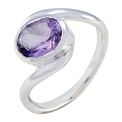 Angel purple solitaire ring with oval faceted gemstone set in twisted silver band