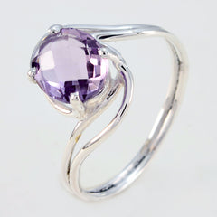 Ying purple solitaire ring with round faceted amethyst in silver twisted bypass prong setting
