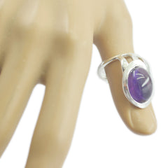 Teresa silver purple solitaire ring with oval cabochon stone on mannequin hand elegant split shank design