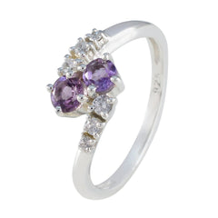 Nari purple toi et moi ring featuring two purple gemstones and small clear accent stones in silver band