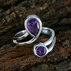 Riya purple toi et moi ring featuring pear and round shaped purple gemstones set in silver band