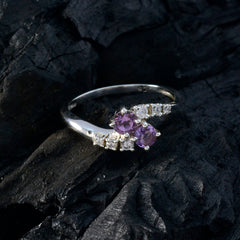 Nari purple toi et moi ring featuring two purple gemstones and small clear stones on silver band