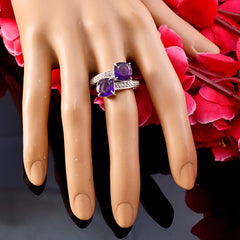 Natalia purple toi et moi ring with two cushion amethyst stones and pave diamond band on hand display