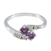 Nari silver ring featuring a purple toi et moi ring design with two purple gemstones and small clear stones