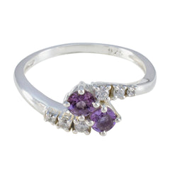 Nari silver ring featuring a purple toi et moi ring design with two purple gemstones and small clear stones