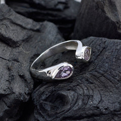 Mila purple toi et moi ring sterling silver open band with two pear shaped purple gemstones on dark textured stone