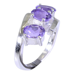 Victoria silver band purple trilogy gemstone ring with three oval faceted amethyst stones in prong settings