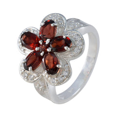 Isla red floral gemstone ring with silver band and five red gemstones shaped like flower petals