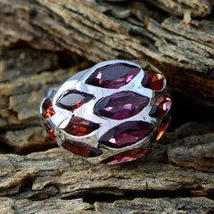Camila red gemstone armor ring with multiple marquise red gemstones set in silver band