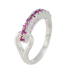 Nisa sterling silver ring with a row of small red gemstones and open bypass design red gemstone contemporary ring