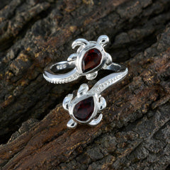 Carolina silver ring featuring two red gemstone fashion ring accents in a turtle design
