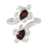Carolina silver ring featuring two red gemstones shaped like turtles red gemstone fashion ring