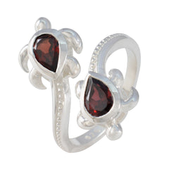 Carolina silver ring with two red gemstone fashion ring accents shaped like turtles