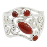 Isadora red gemstone filigree ring with intricate silver swirls and multiple red stones