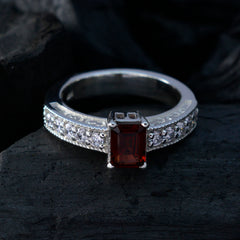 Victoria silver red gemstone halo ring with rectangular red center stone and clear accent stones