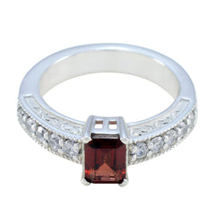 Victoria red gemstone halo ring with rectangular red stone and clear stones on silver band