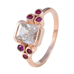 Florencia red gemstone hepta ring rose gold band with square clear center stone and six small red gems