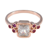 Florencia red gemstone hepta ring rose gold band with central square white stone and six small red gems