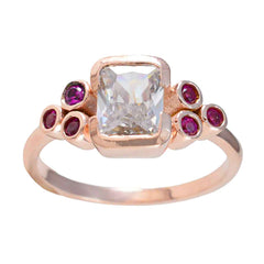 Florencia rose gold red gemstone hepta ring with bezel set clear center stone and six red round stones