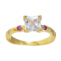 Saanvi gold ring featuring red gemstone ring for women with clear center stone and two small red gemstones
